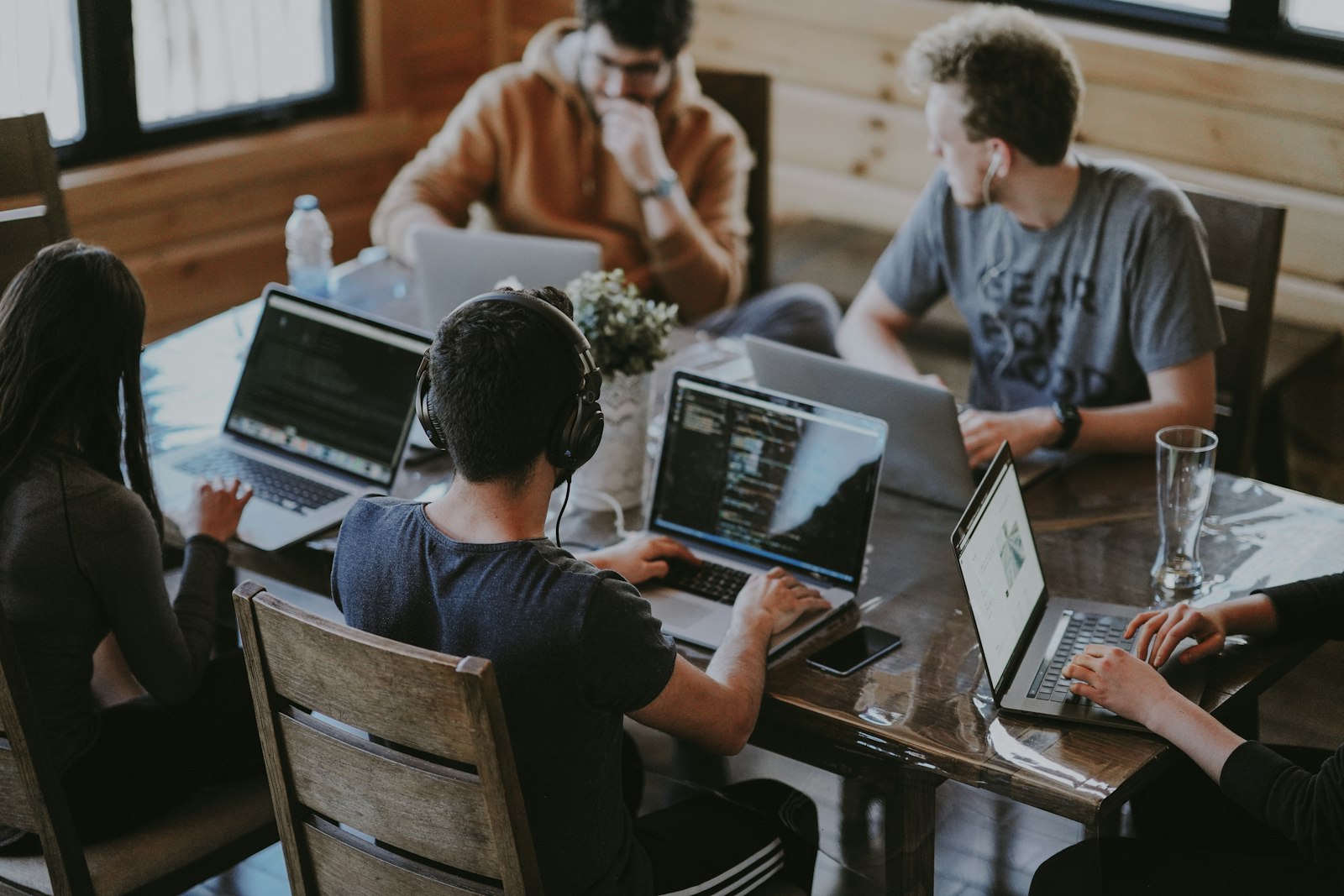 A growing engineering team collaborating around a table